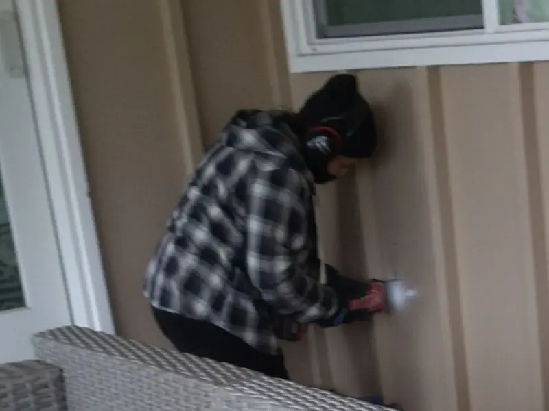 Professional electrician installing an exterior outlet in The Colony