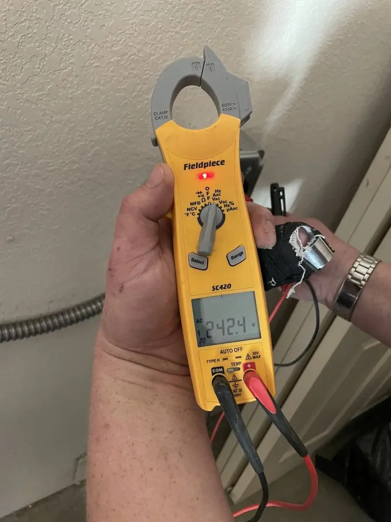 Voltage testing with clamp meter during Whole House Surge Protector in The Colony